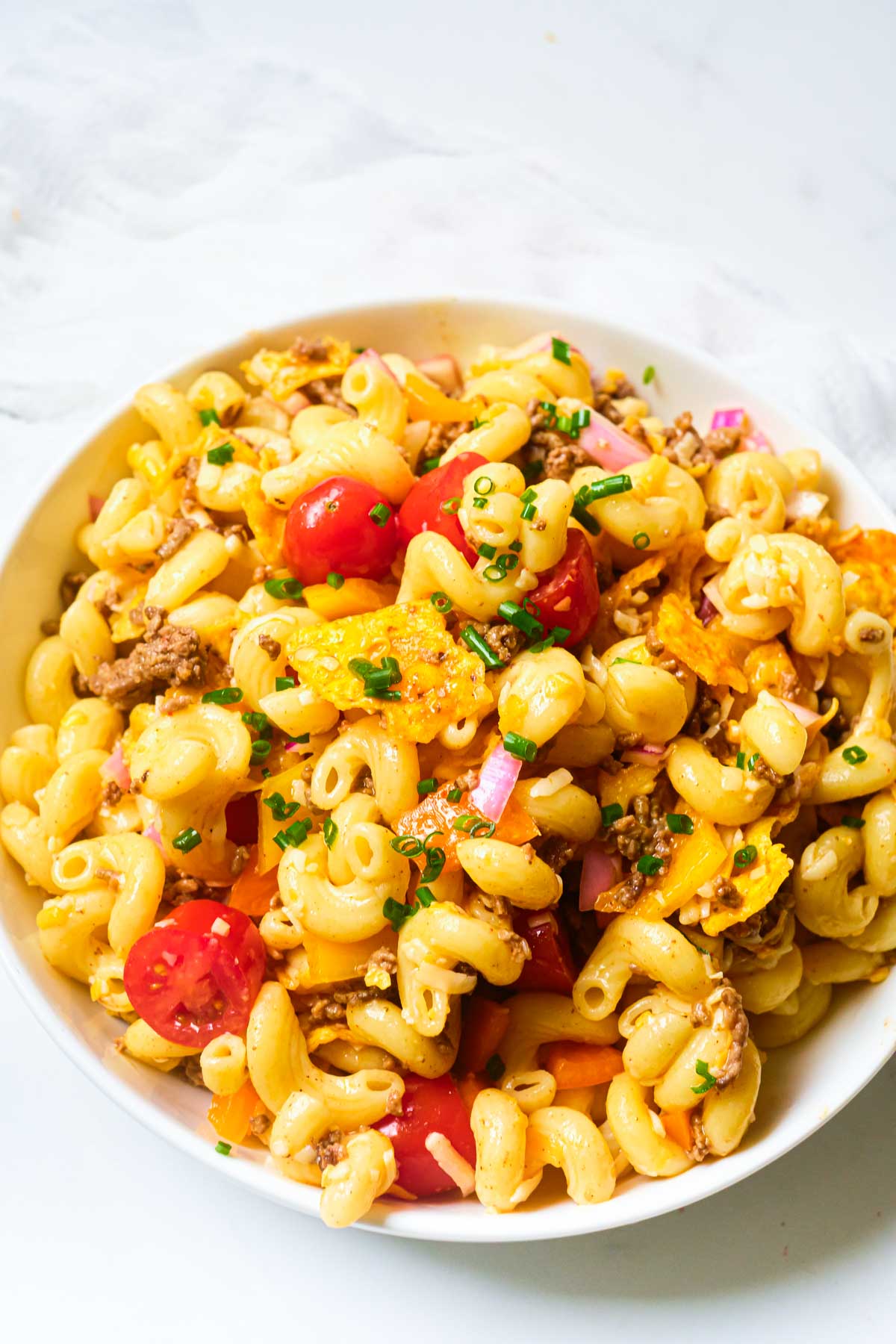 a bowl filled with taco pasta salad