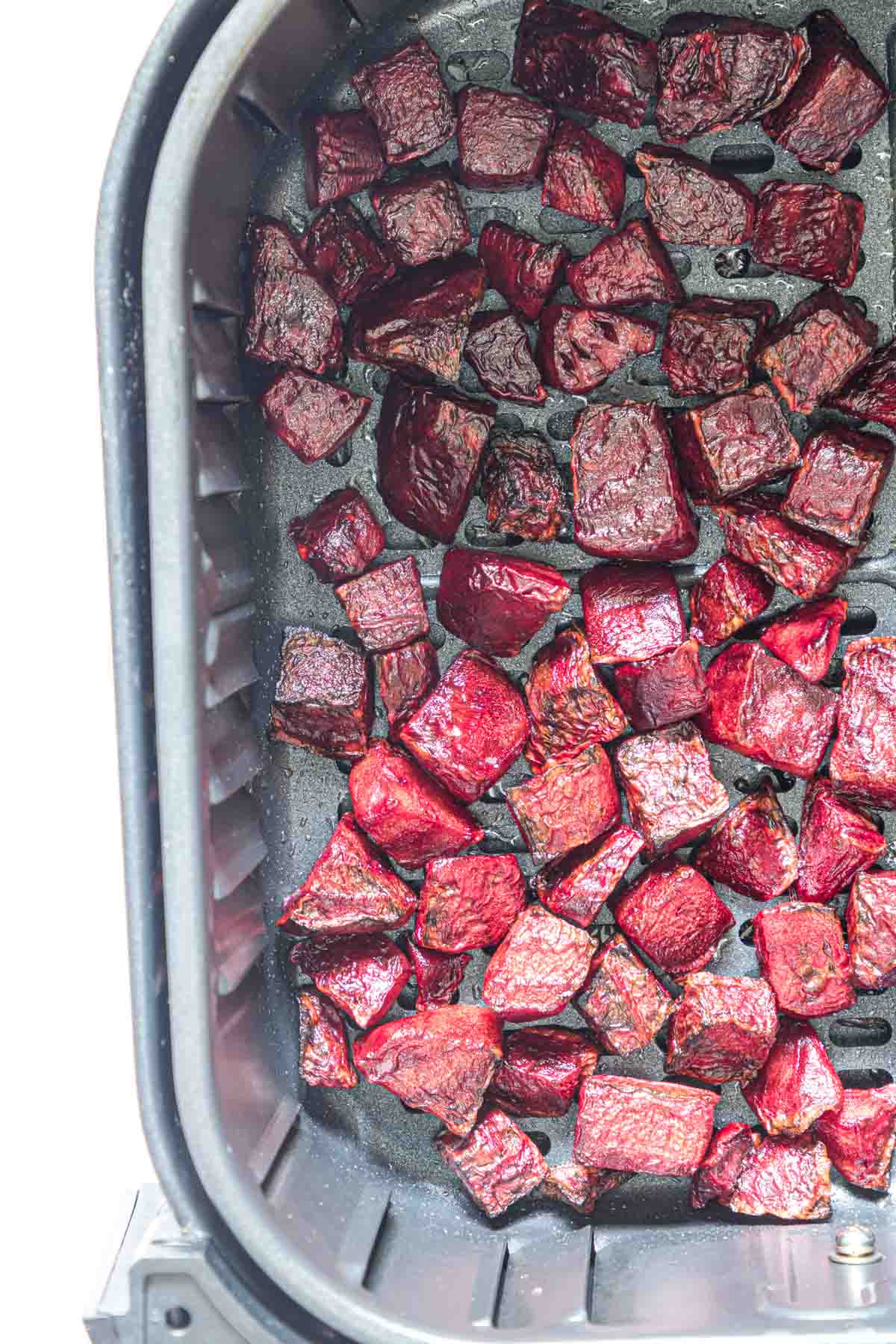 close up view of the finished air fryer beets inside the air fryer basket
