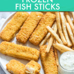 fish sticks on a plate with a side of fries and tartar sauce