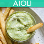 a bowl of pesto aioli with fries on the side
