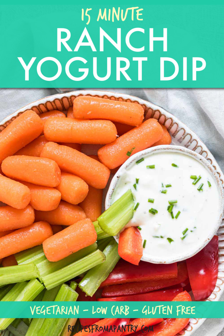carrots, celery and red peppers in a bowl with ranch sauce on the side