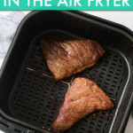 two pieces of steak in an air fryer