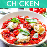 chicken topped with cherry tomatoes and basil in a bowl