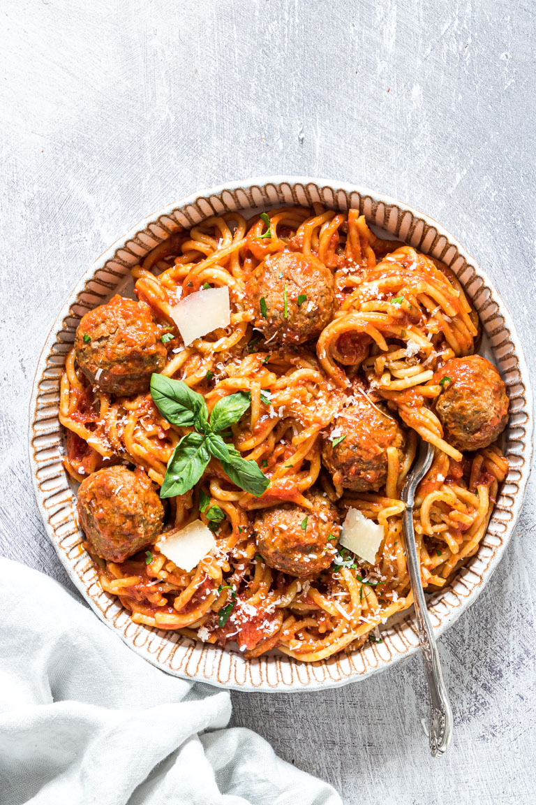 a bowl of slow cooker spaghetti and meatballs