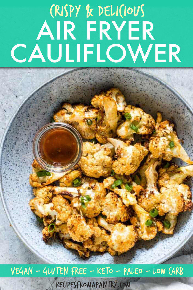 A BOWL OF FRIED CAULIFLOWER WITH A SIDE DISH OF SAUCE