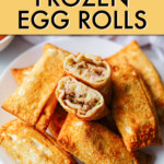 A PILE OF EGG ROLLS ON A PLATE