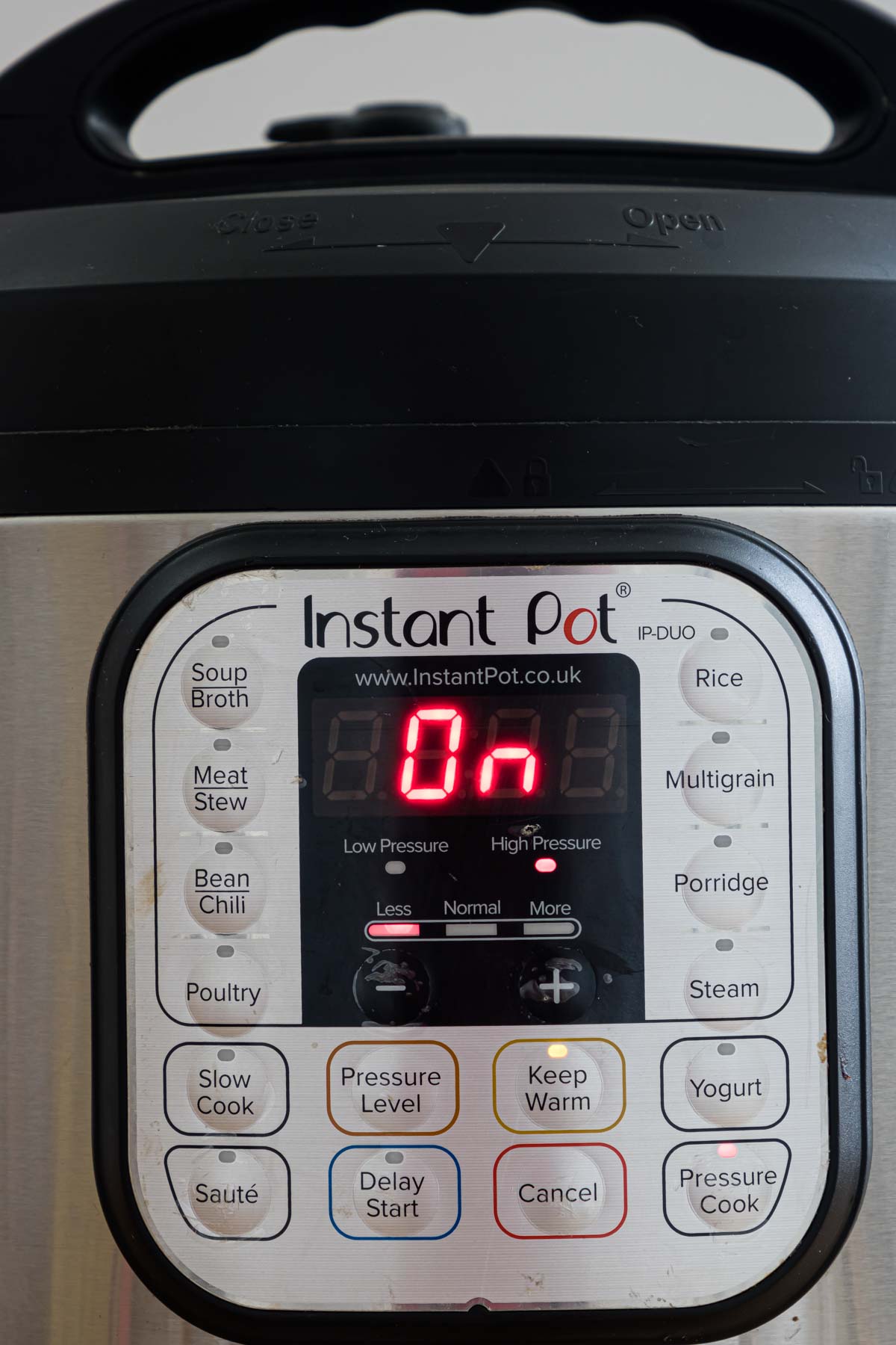 close up view of the instant pot with no burn message