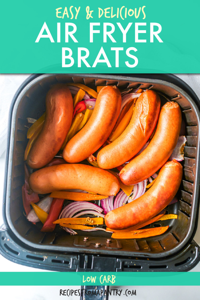 six brats with onions and pepper in an air fryer basket