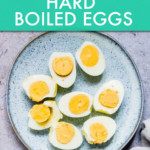 several halved boiled eggs on a plate