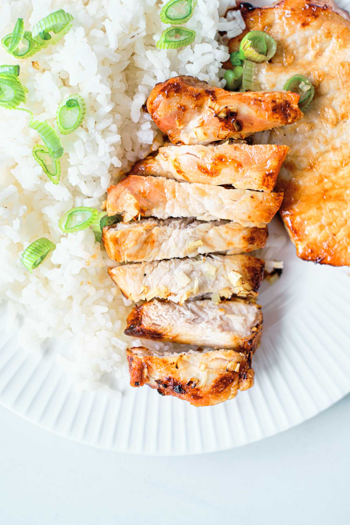 top down view of the finished pork steak in air fryer recipe served with rice
