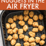 chicken nuggets in an air fryer basket
