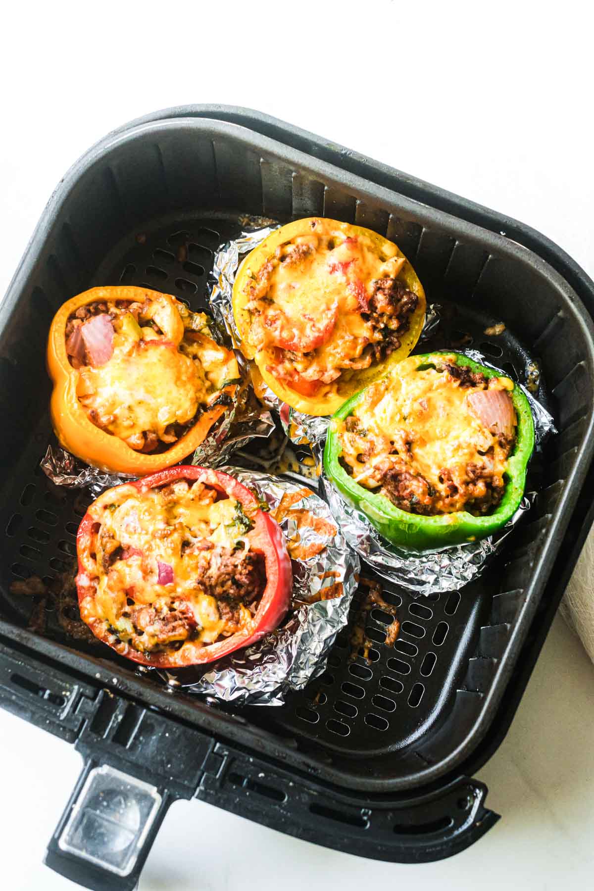 the cooked stuffed peppers in air fryer basket