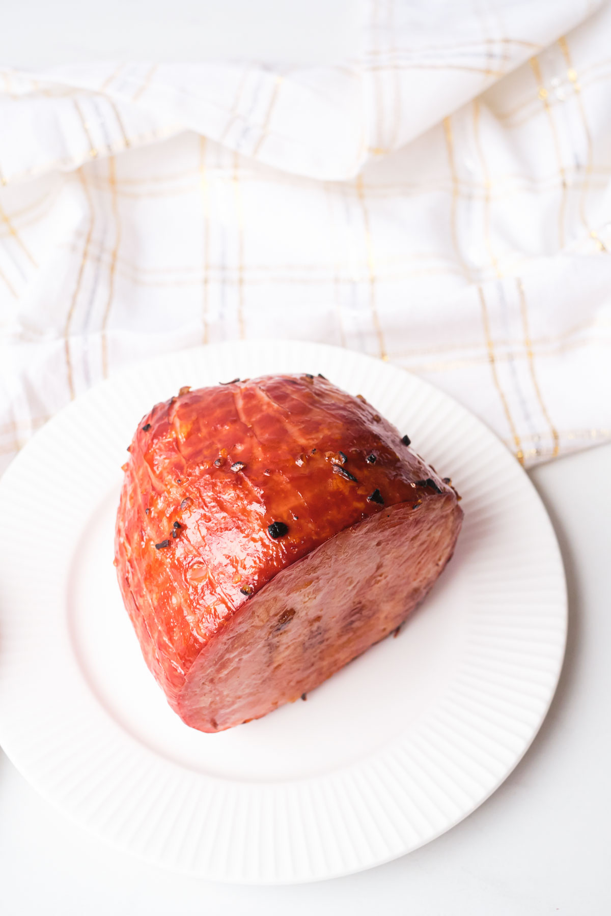 top down view of the air fryer ham served on a white plate