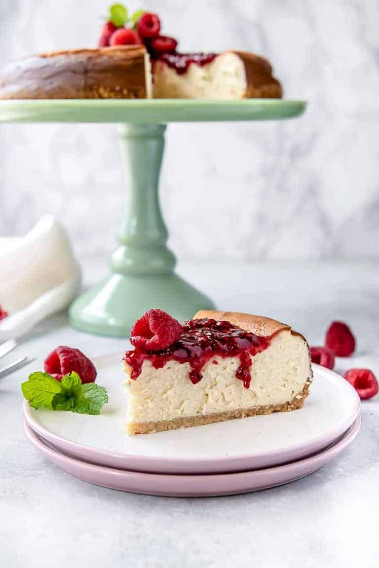 slice of keto cheesecake with a drizzle of jam
