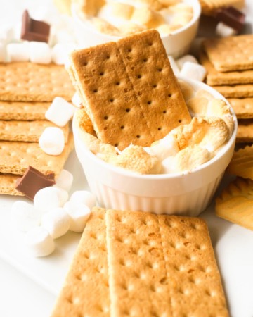 a graham cracker stuck into the completed air fryer smores dip