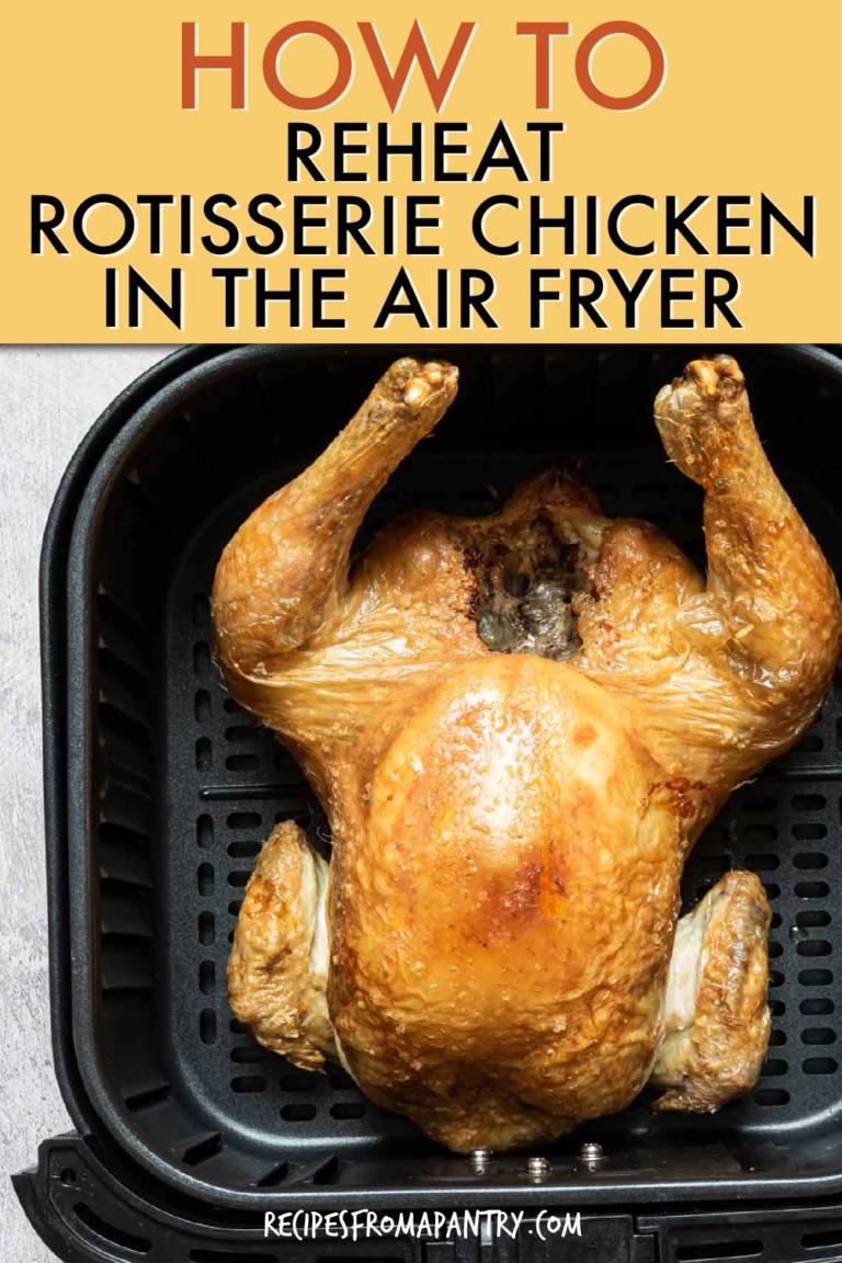 a whole cooked chicken in an air fryer basket