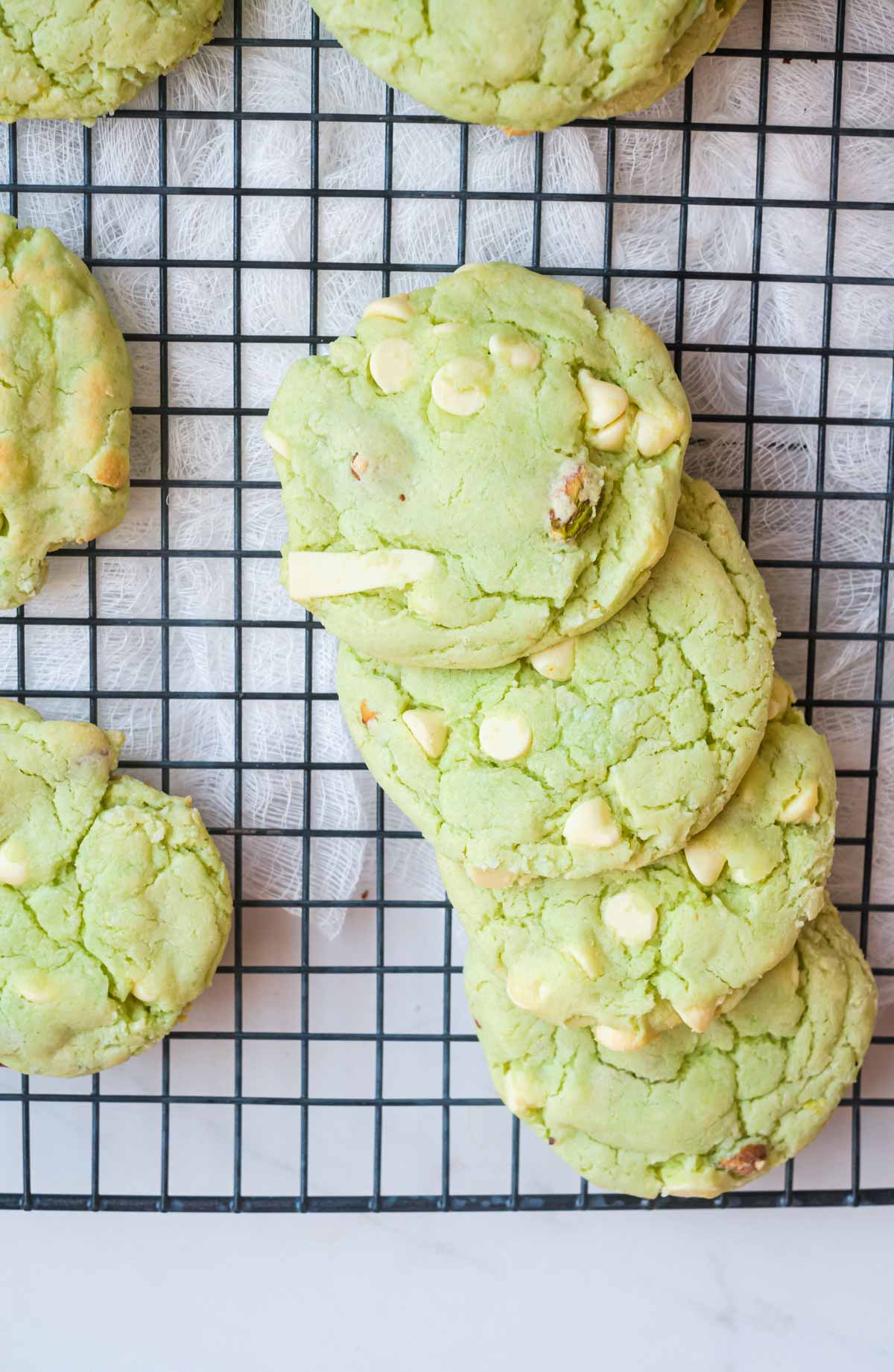 top down view of the completed air fryer pistachio pudding cookies on a cooling rack