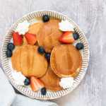 air fryer frozen pancakes served with whipped cream and berries