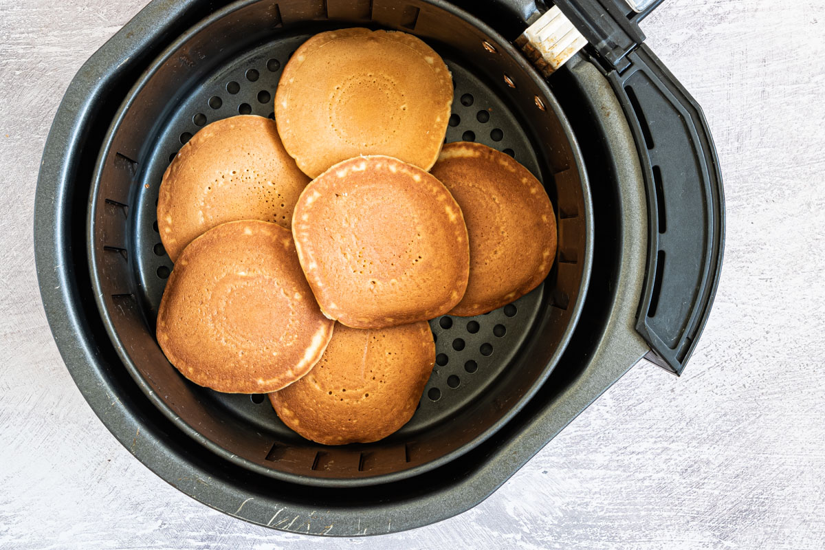 top down view of the air fryer frozen pancakes inside the air fryer basket