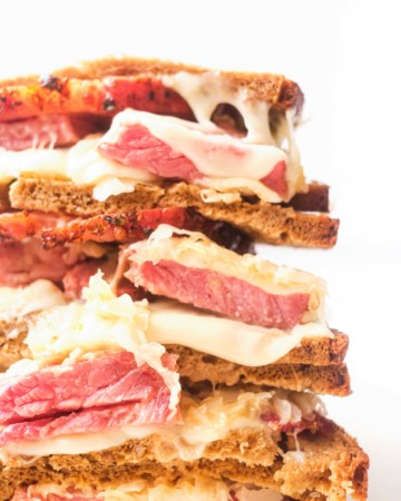 close up of stacked air fryer reuben sandwich halves