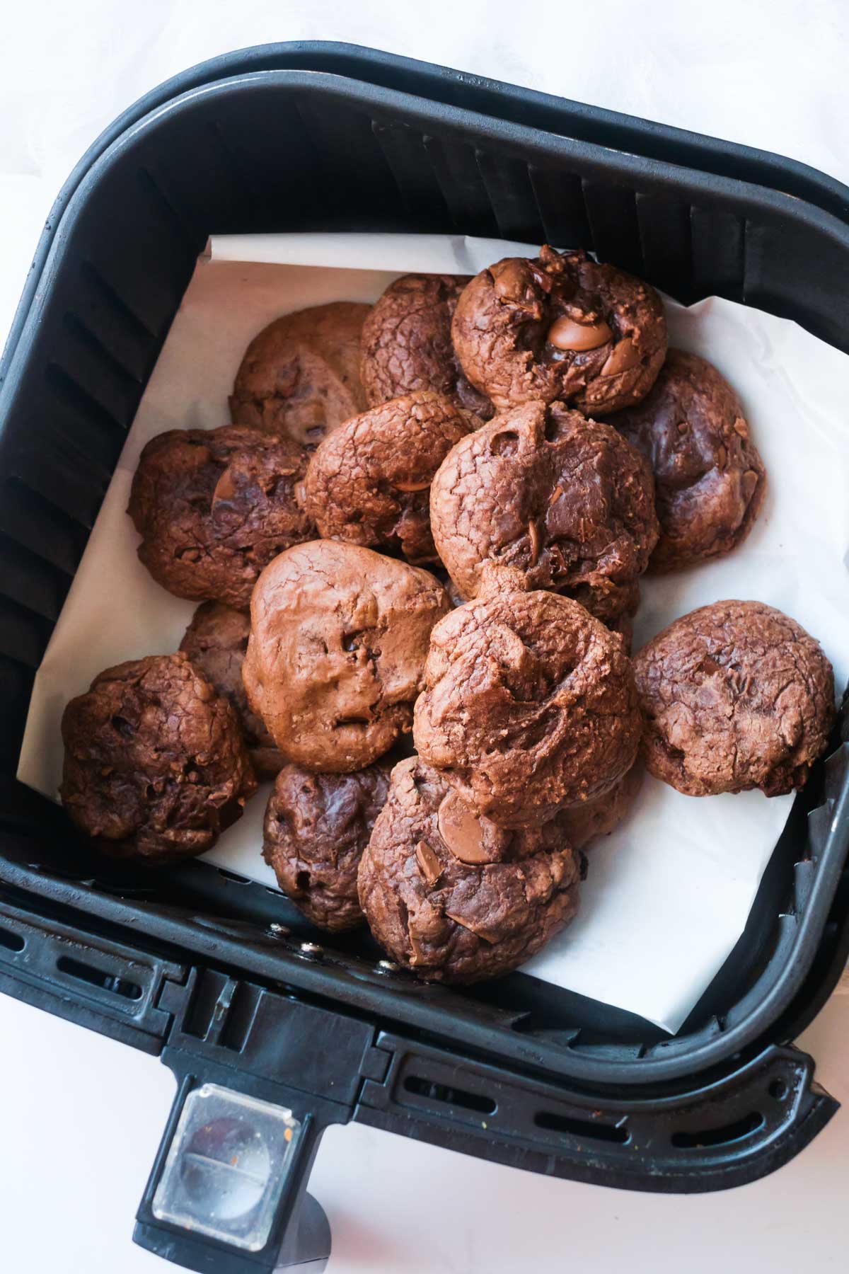 the finished brownie mix cookies inside the air fryer basket