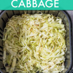 shredded cabbage in an air fryer basket