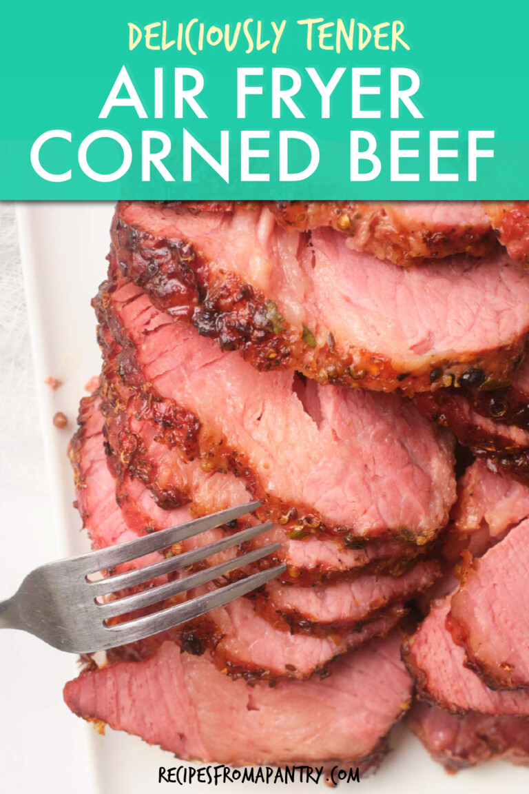 A fork poking into sliced corned beef