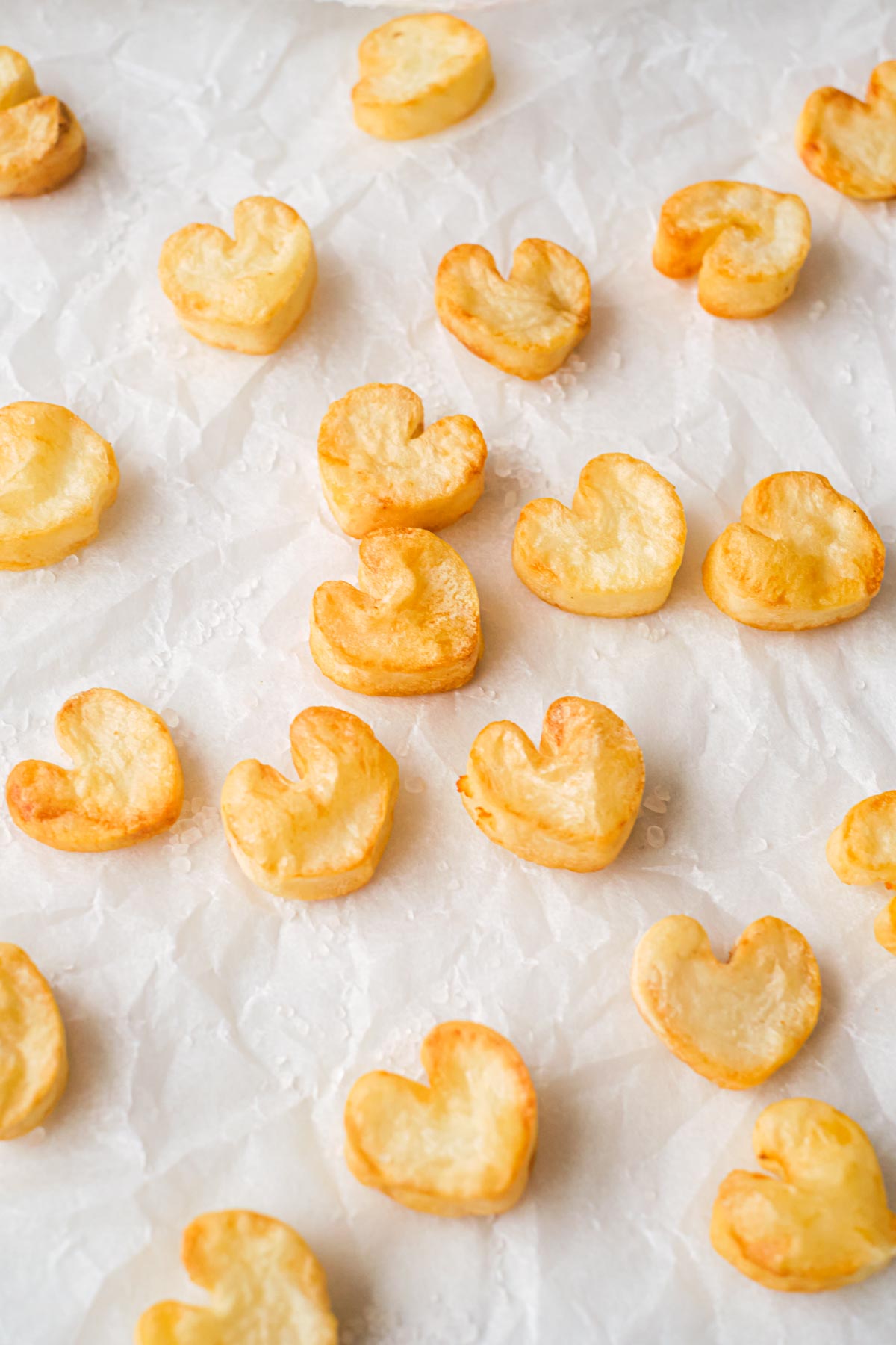 the completed heart potatoes on top of parchment paper