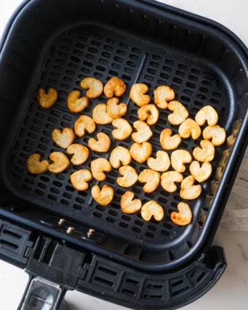 top down view of the finished heart potatoes in air fryer basket