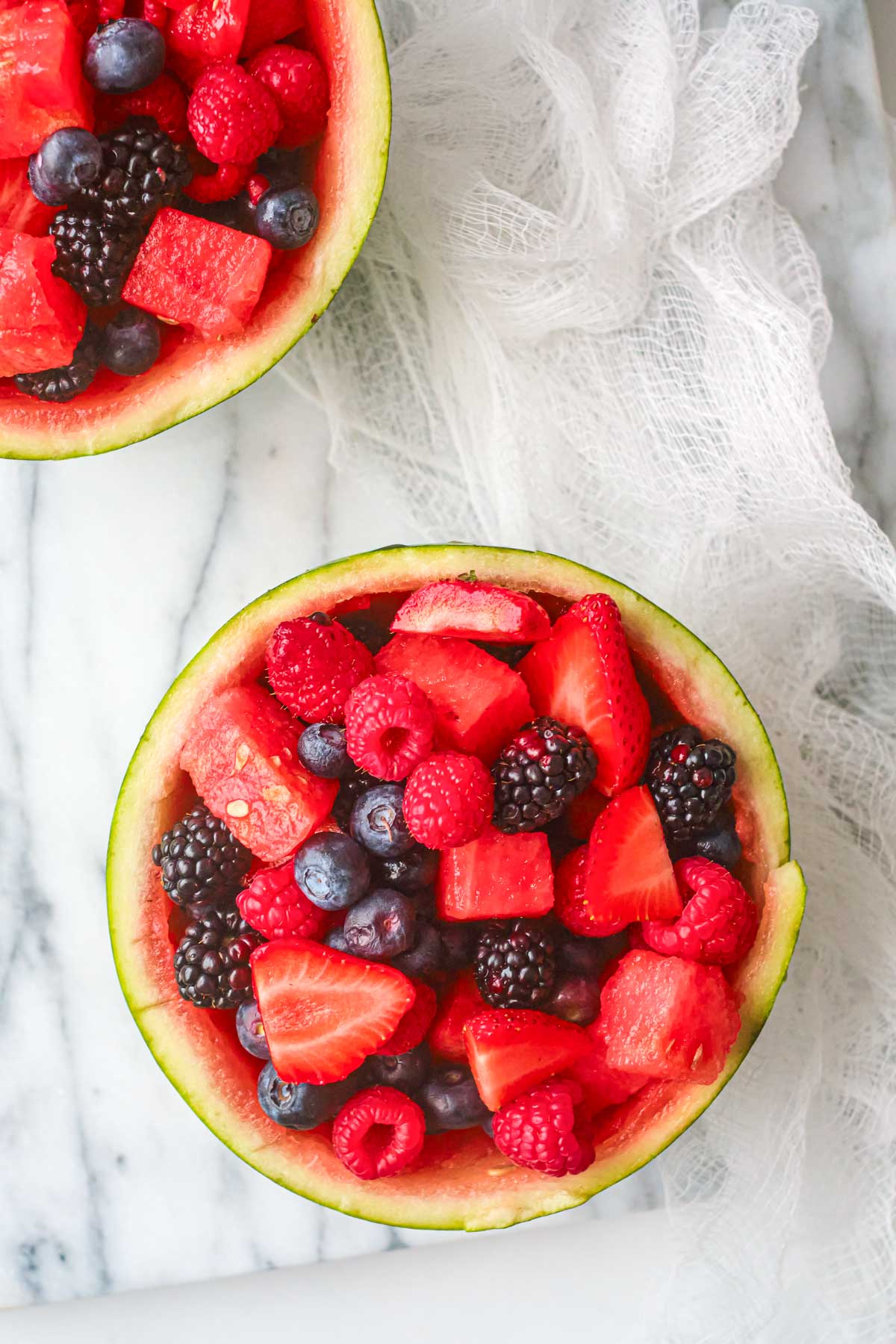 the finished watermelon fruit bowl filled with fresh berries