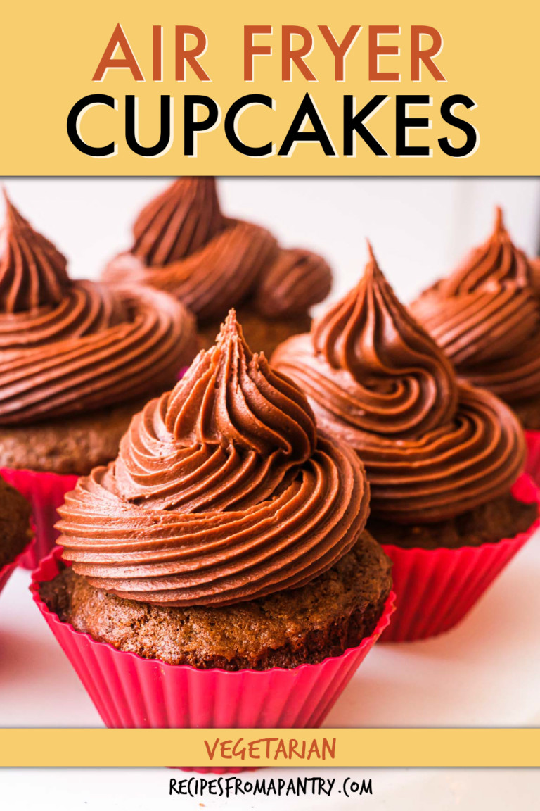 A ROW OF CHOCOLATE CUPCAKES WITH CHOCOLATE FROSTING