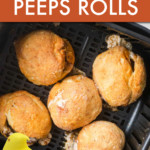 DOUGH WRAPPED PEEPS IN AN AIR FRYER BASKET WITH A PEEP IN THE FOREGROUND