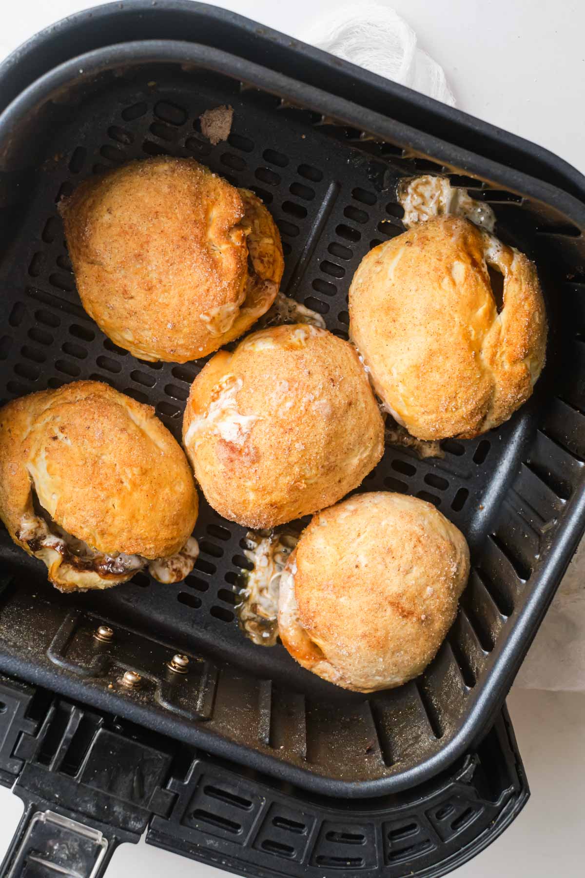 top down view of the cooked air fryer peeps rolls inside the air fryer basket