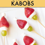 skewers made of strawberries, marshmallows and grapes on a plate