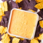 the completed air fryer mexican cheese dip surrounded by tortilla chips