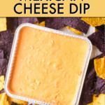 CHEESE DIP IN A SQUARE PAN SURROUNDED BY TORTILLA CHIPS