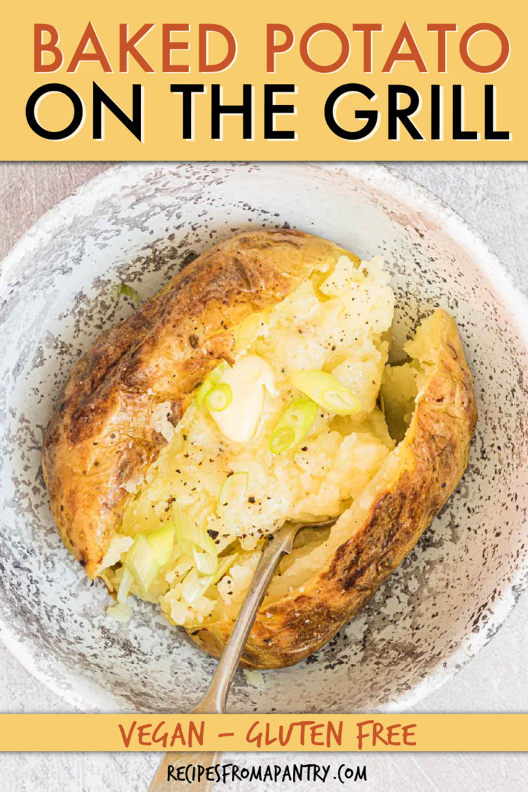 A SPLIT BAKED POTATO IN A BOWL WITH A FORK