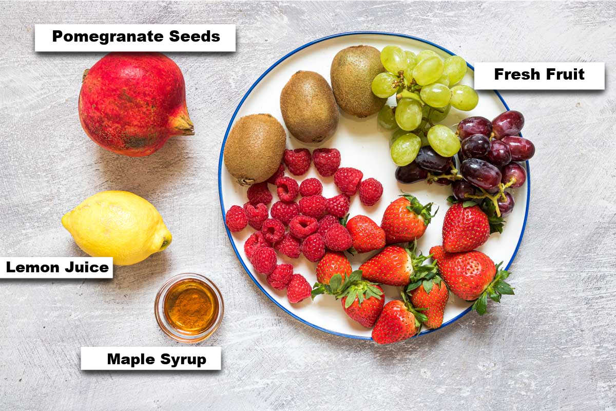 the ingredients needed for making christmas fruit salad