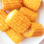 top down view of a plate filled with cooked frozen corn on the cob