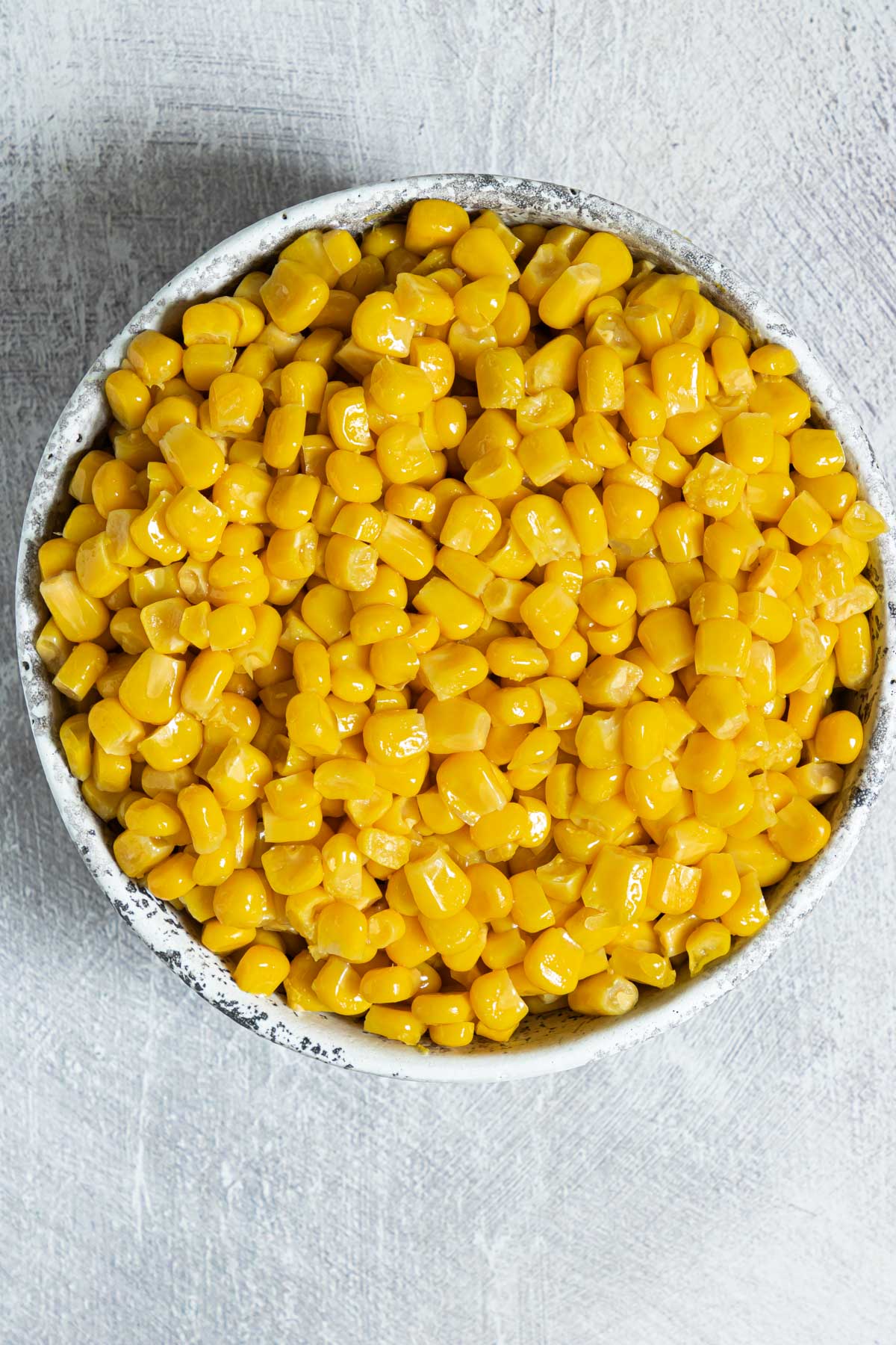 top down view of a bowl filled with cooked canned corn