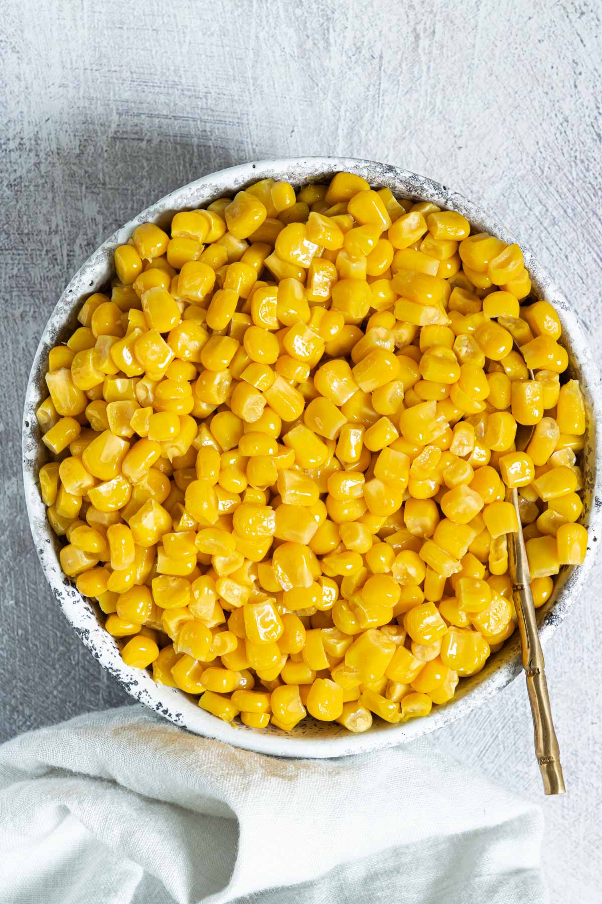 a serving dish filled with cooked canned corn