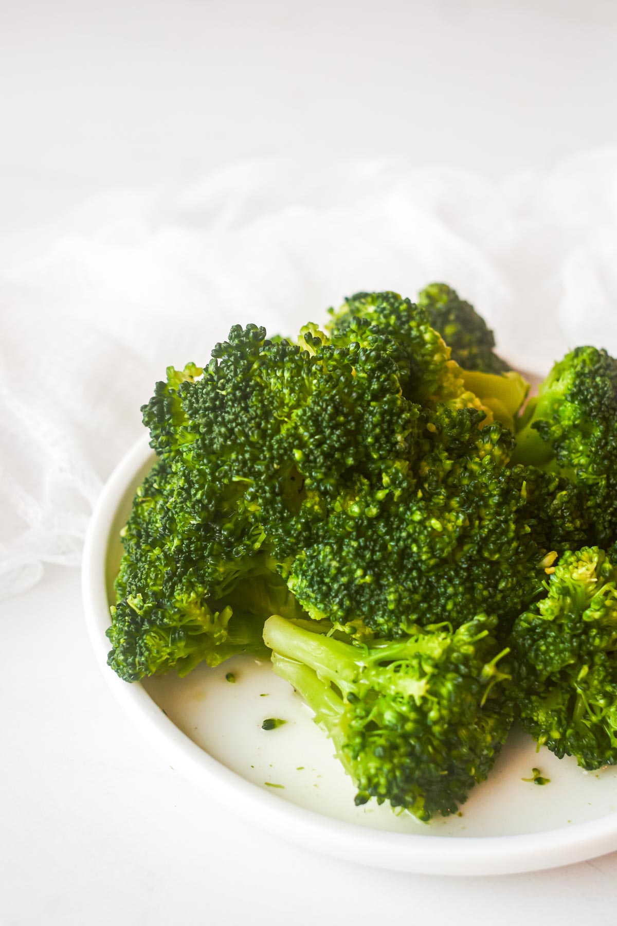 a plate of steamed broccoli