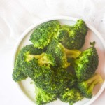 top down view of the how to steam broccoli in microwave recipe served on a white plate
