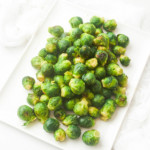 roasted frozen brussel sprouts on a white serving dish