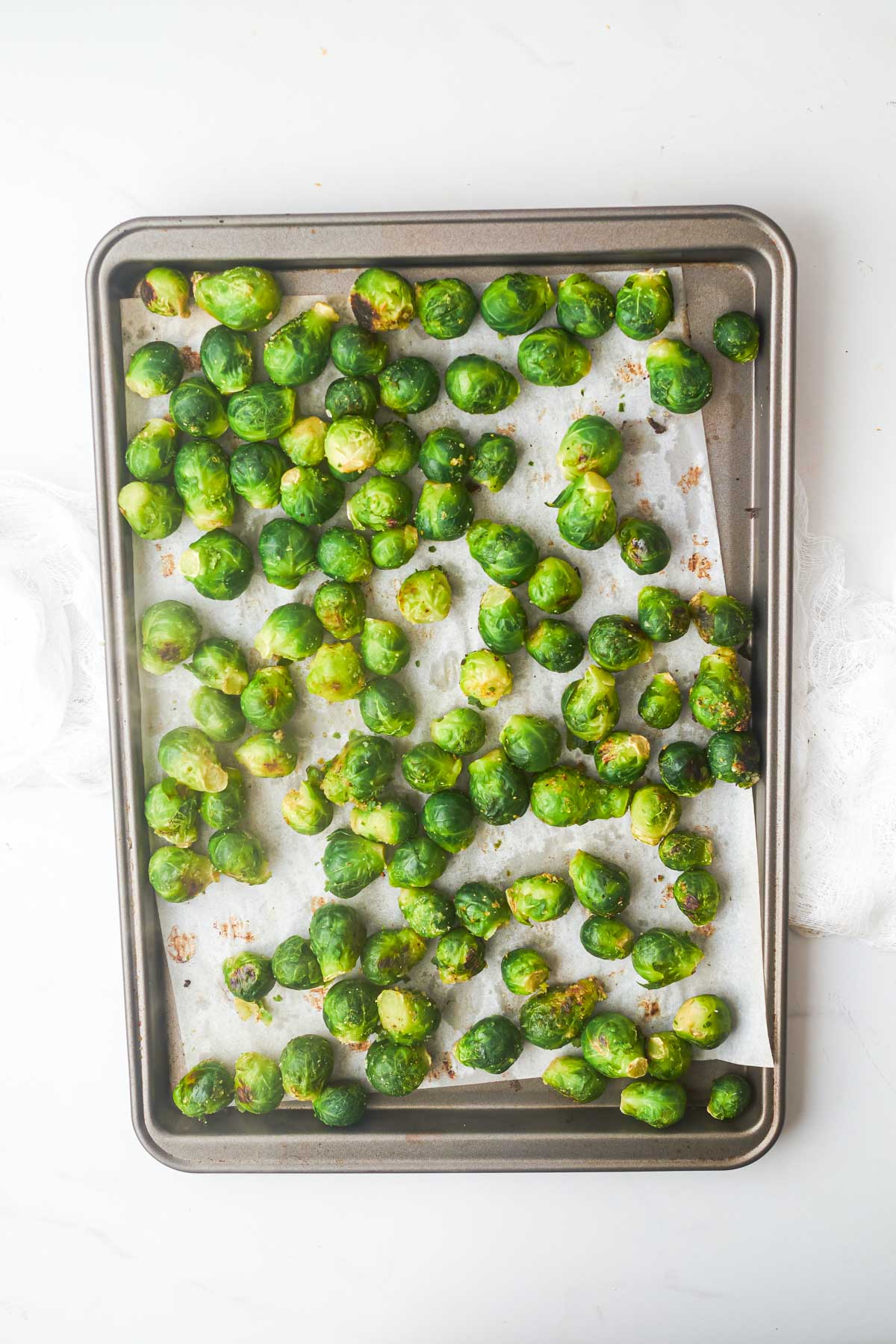 the finished roasted frozen brussel sprouts on a sheet pan