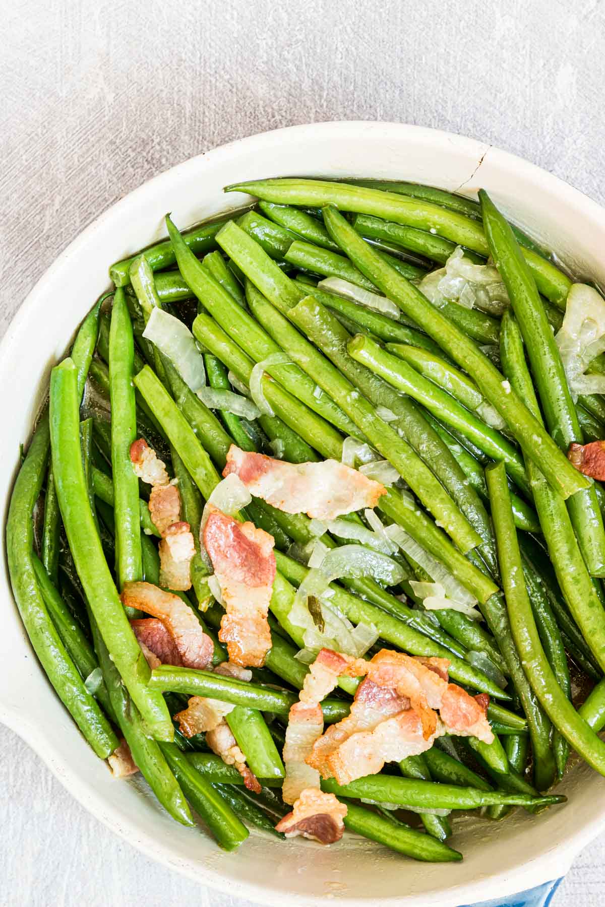 close up view of the smothered green beans with bacon