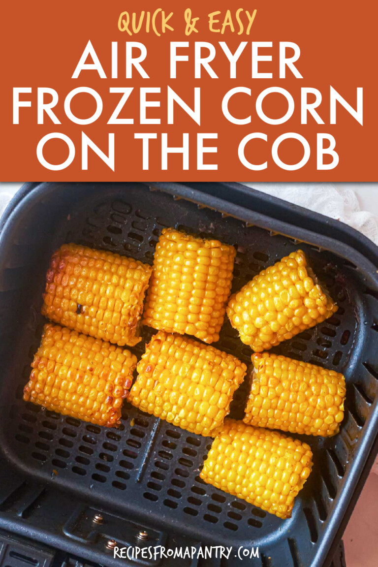 several corn cobs cut in halves in an air fryer basket