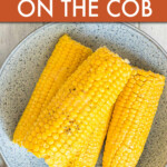 Four corn cobs on a plate