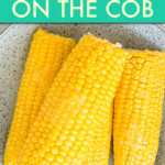 Four corn cobs on a plate