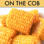 A close-up of a pile of cooked corn cobs on a plate